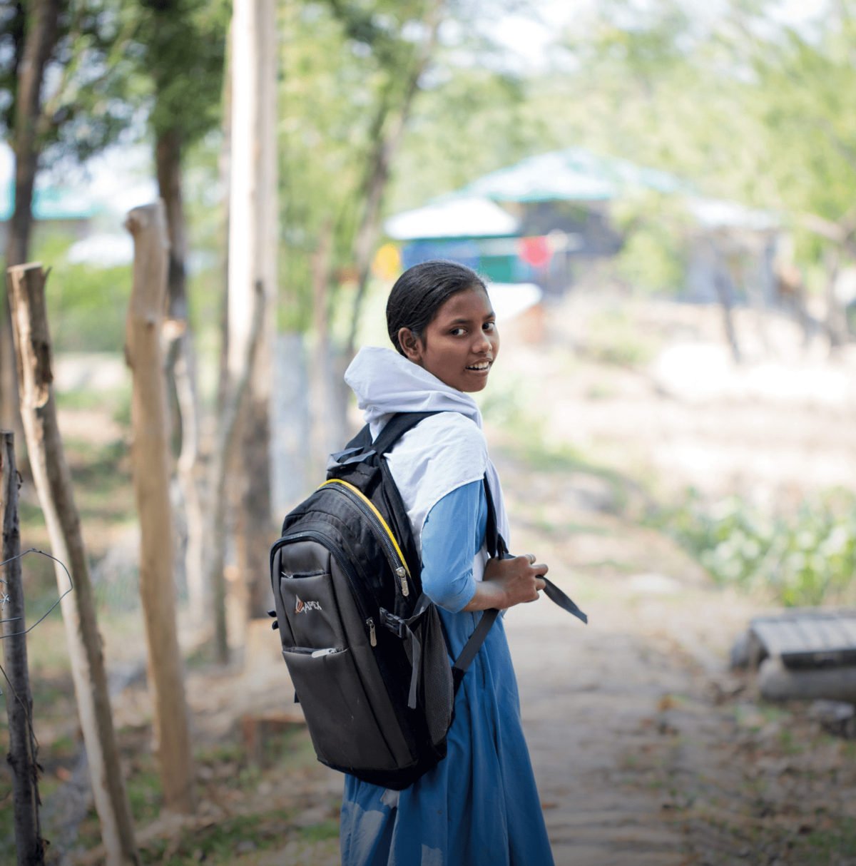 A girl goes to the school in Bangladesh.