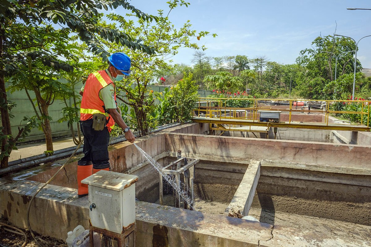 Sanitation worker operating a domestic wastewater management site in the city of Bekasi, Indonesia.
